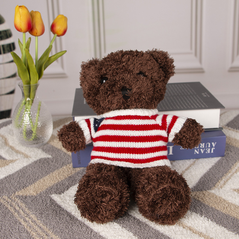 Red and white striped sweater black bear
