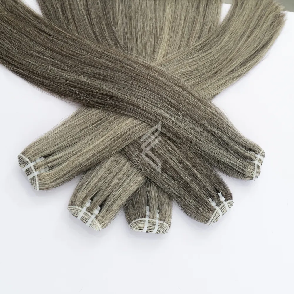 Extensions de cheveux humains de trame invisible blond gris cendré fumé Luxe brut Vietnamien Faisceaux de cheveux d'un donneur