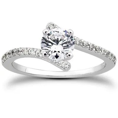 A stunning solitaire diamond ring with a pave band that adds extra sparkle and shine to your finger.
