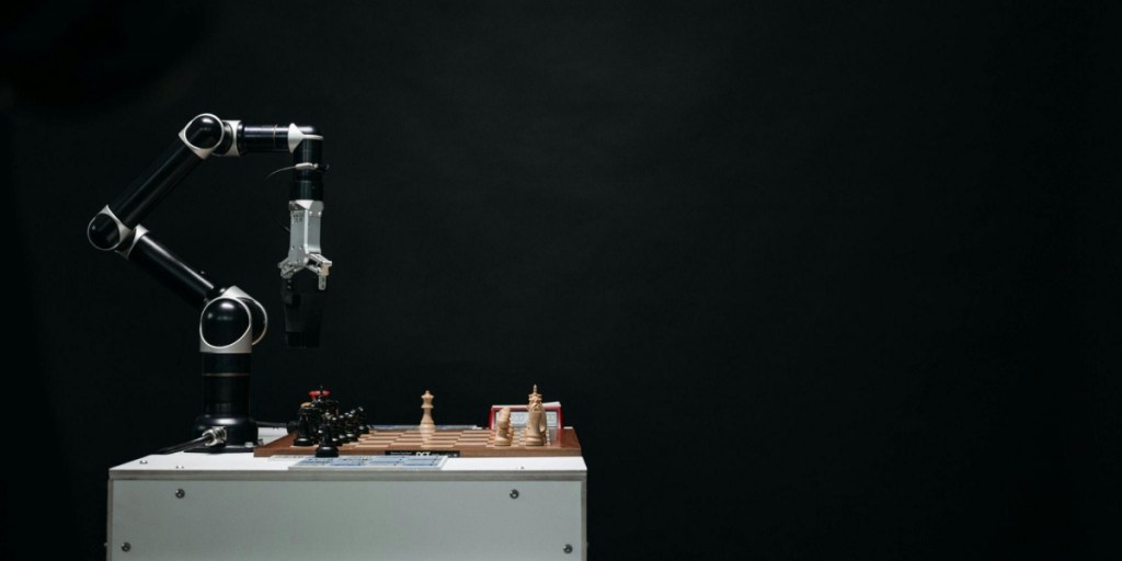 A robotic arm playing chess