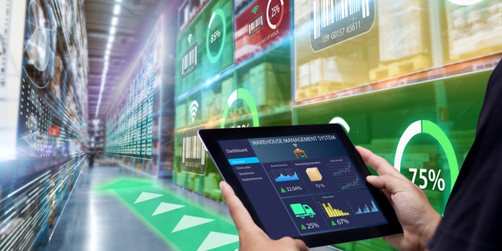 Worker using a warehouse management system software