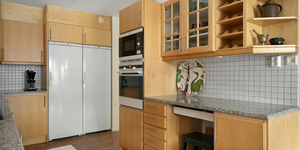 Contemporary kitchen with light wood cabinets