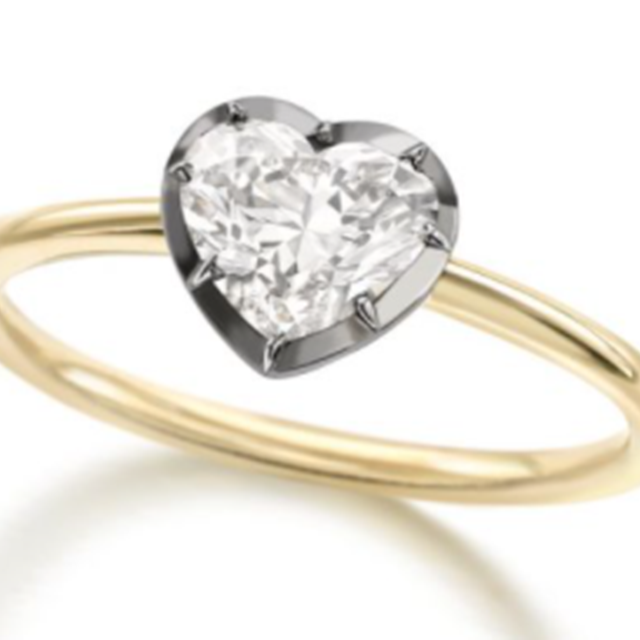 14K yellow gold with blackened oxidized white gold around a 6mm Heart shape moissanite  Size 9  and the band is 2mm wide Ring