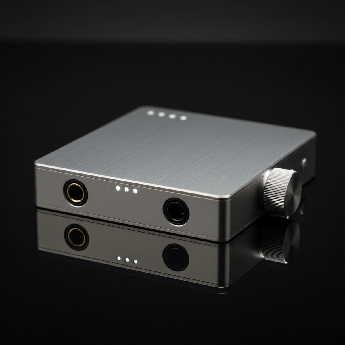 Premium portable audio player with brushed titanium body and tactile volume knob.