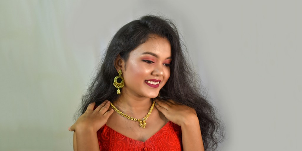 Woman wearing gold jewelry