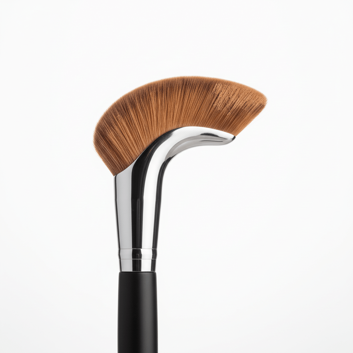 Innovative C-shape bronzer brush with synthetic bristles on a white studio background.