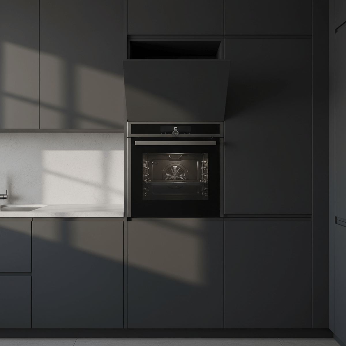 Integrated charcoal convection oven in custom cabinetry with brushed metal trim.