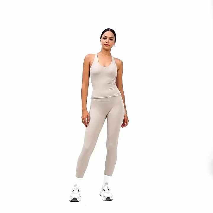 Tuta larga personalizzata all'ingrosso tuta da ginnastica Sexy con bretelle  a schiena aperta tute sportive per donne Yoga Fitness indossare tute