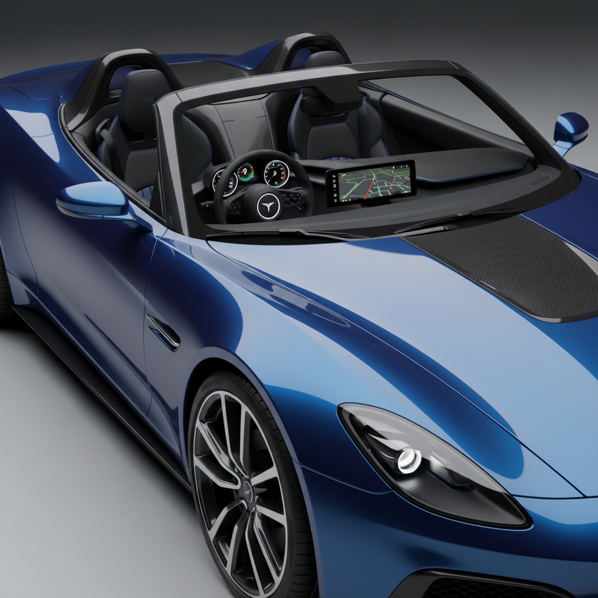 Glossy deep blue electric roadster with black trim in studio lighting.
