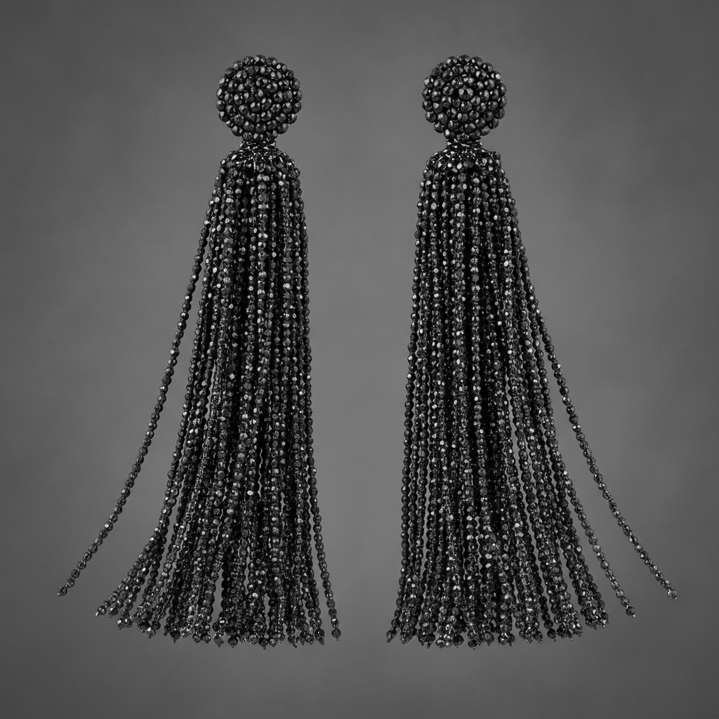 Luxurious dark spinel gemstone tassel earrings with elegant fluid movement.