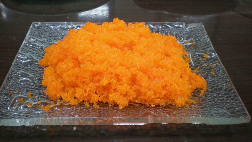 ovas alaranjadas dos peixes de voo do masago do tobiko para o sushi e culinárias japonesas