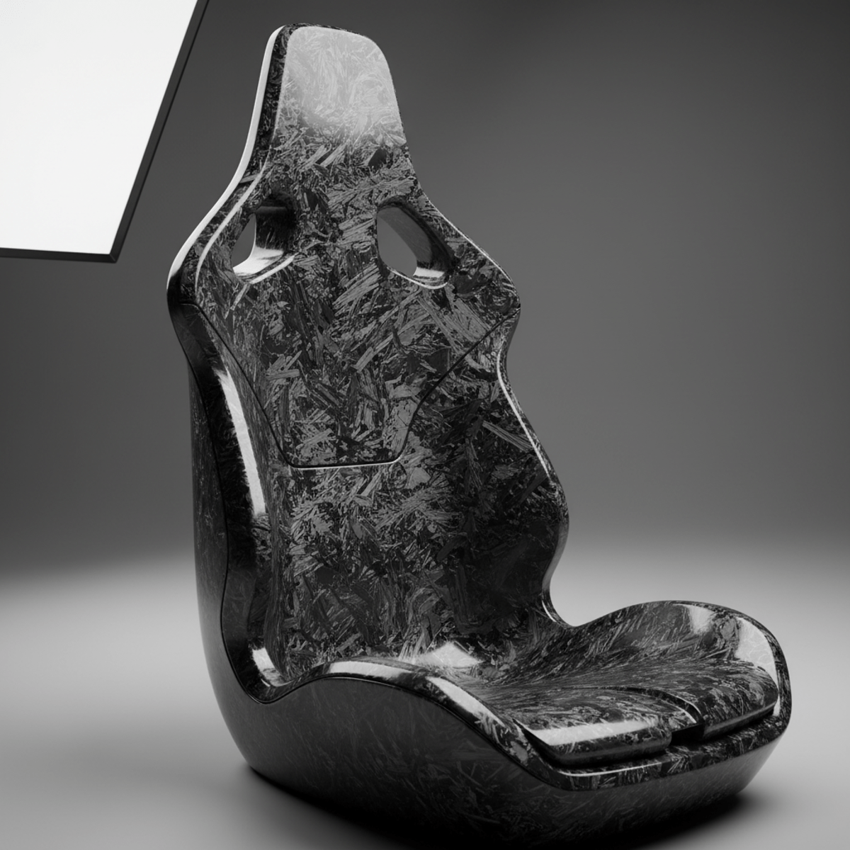 Close-up of a forged carbon bucket seat with a glossy finish and swirling texture.