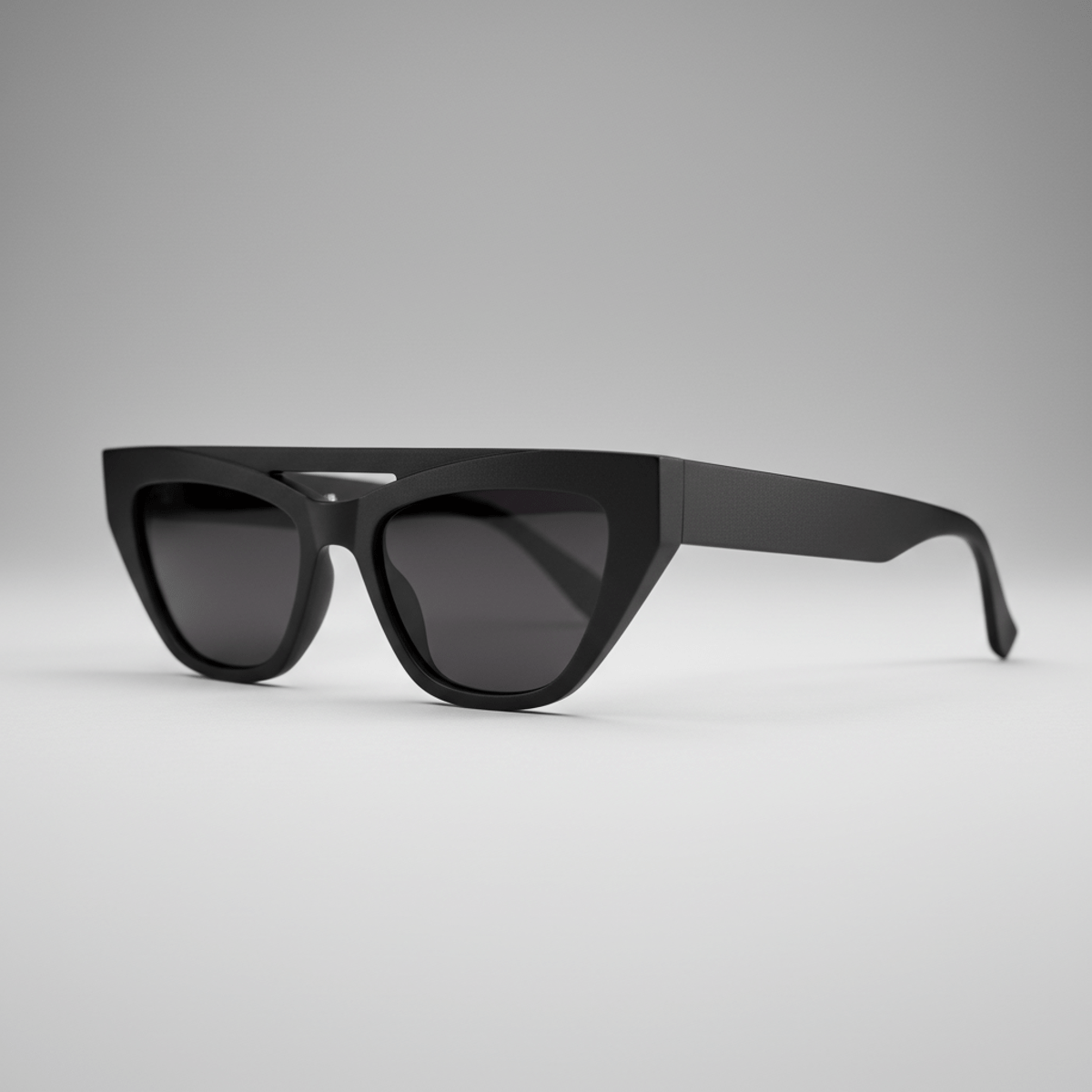 Matte black cat-eye sunglasses with sharp geometric lines and wing tips.