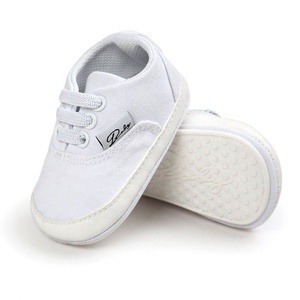 infant white canvas shoes