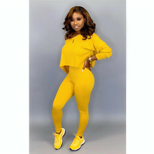 yellow and black jogging suit