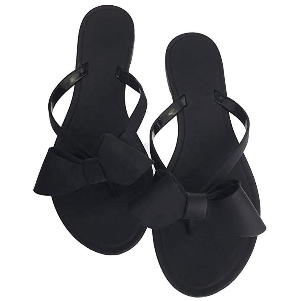 black jelly sandals with bow