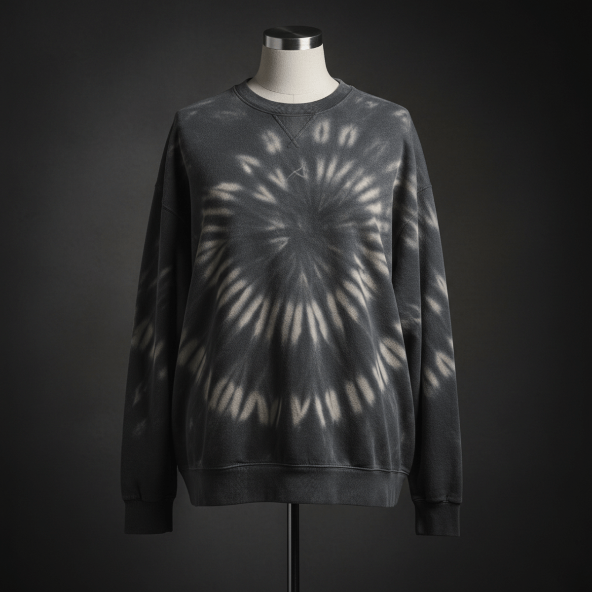 Charcoal tie dye sweatshirt with subtle reverse dye swirls on a mannequin.