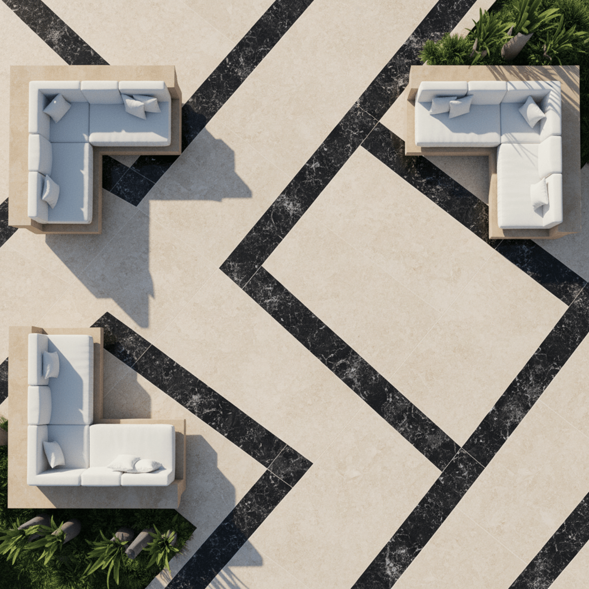 Overhead view of a modern patio with asymmetric black and cream pavers and white lounging areas.