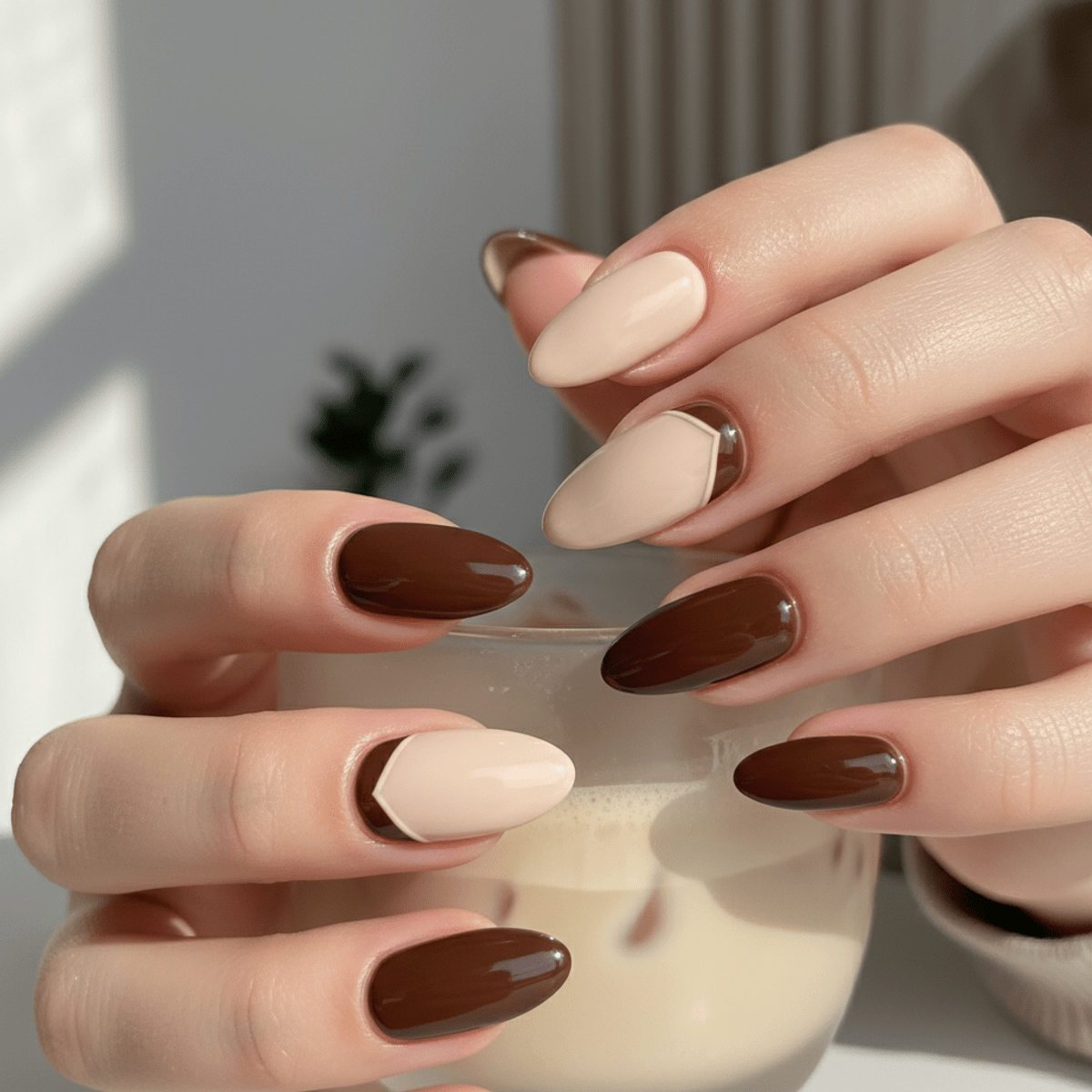 Mocha mousse nails with vertical split design, creamy beige and deep coffee brown polish.