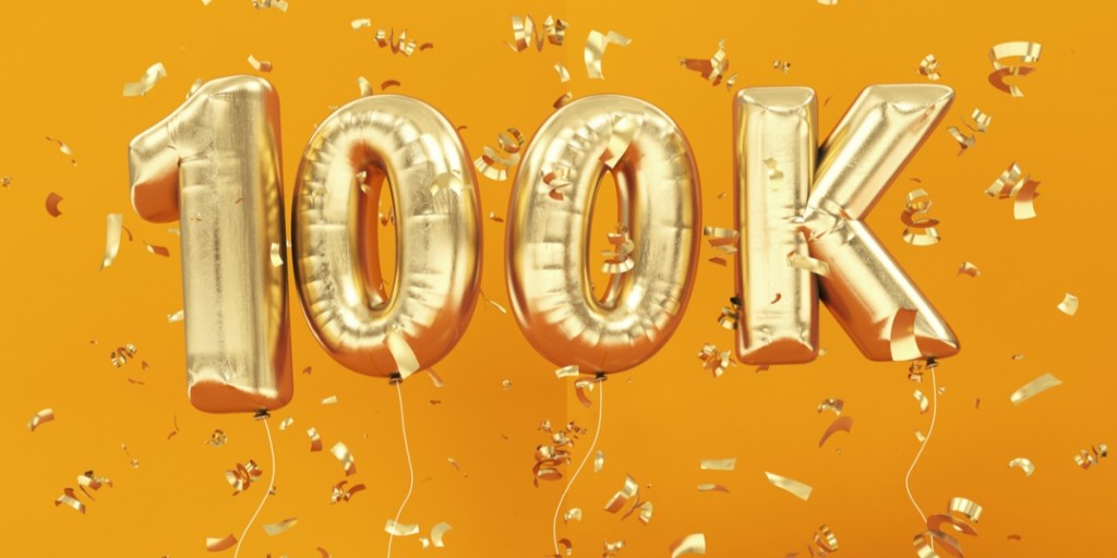 100k written using foil balloons