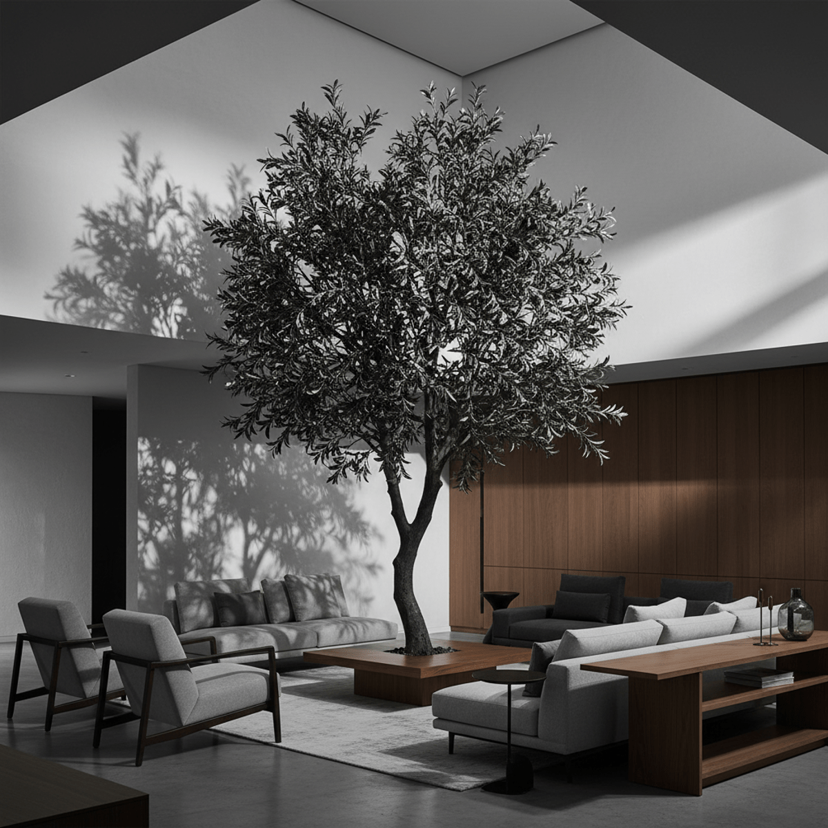Faux black olive tree with sculptural silhouette in a modern, monochrome living room.