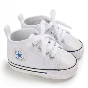 white canvas baby shoes