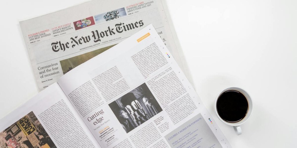 The New York Times newspaper on a white table