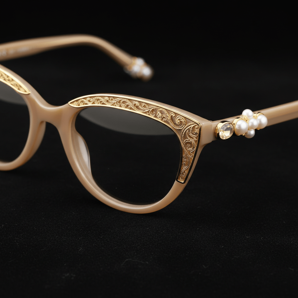 Extreme close-up of cat-eye sunglasses with pearl and gemstone details.