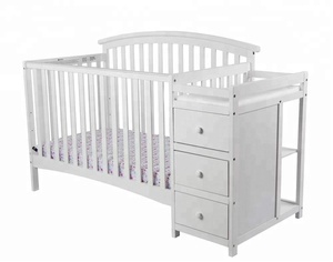 white crib with changing table