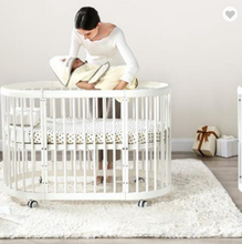 round wooden crib