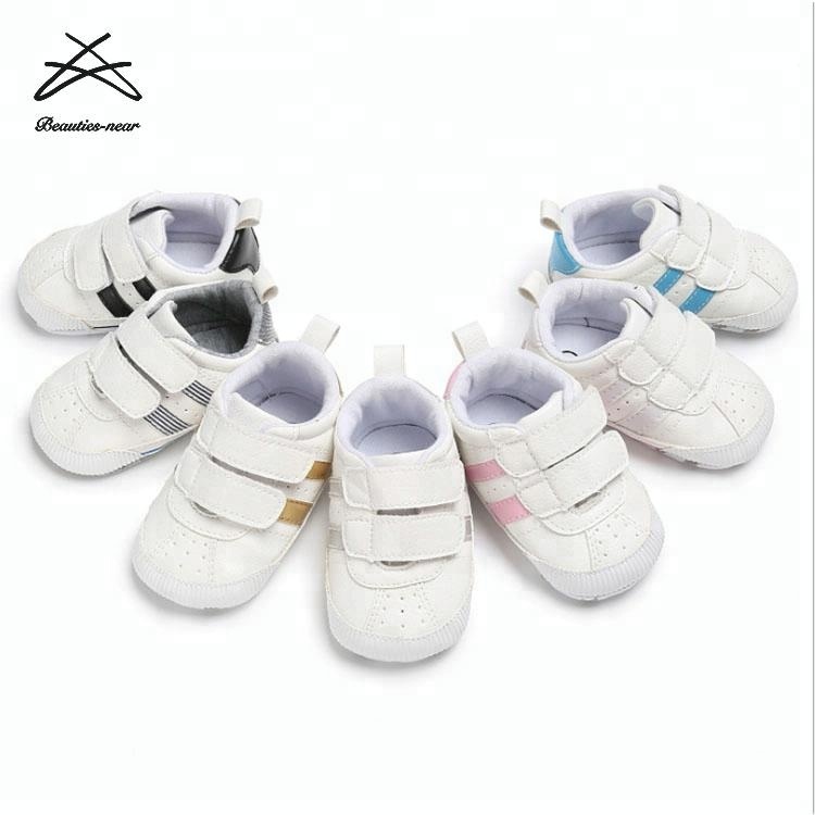 white canvas baby shoes