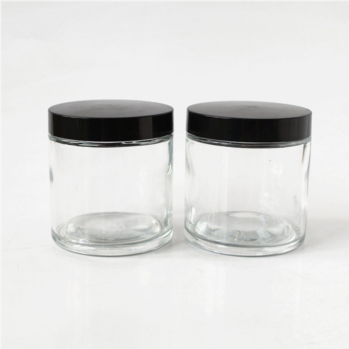straight slide clear round glass jar for weeds herbs skin cream mask bottle with black matte or smooth screw lid 2oz 3oz 4oz