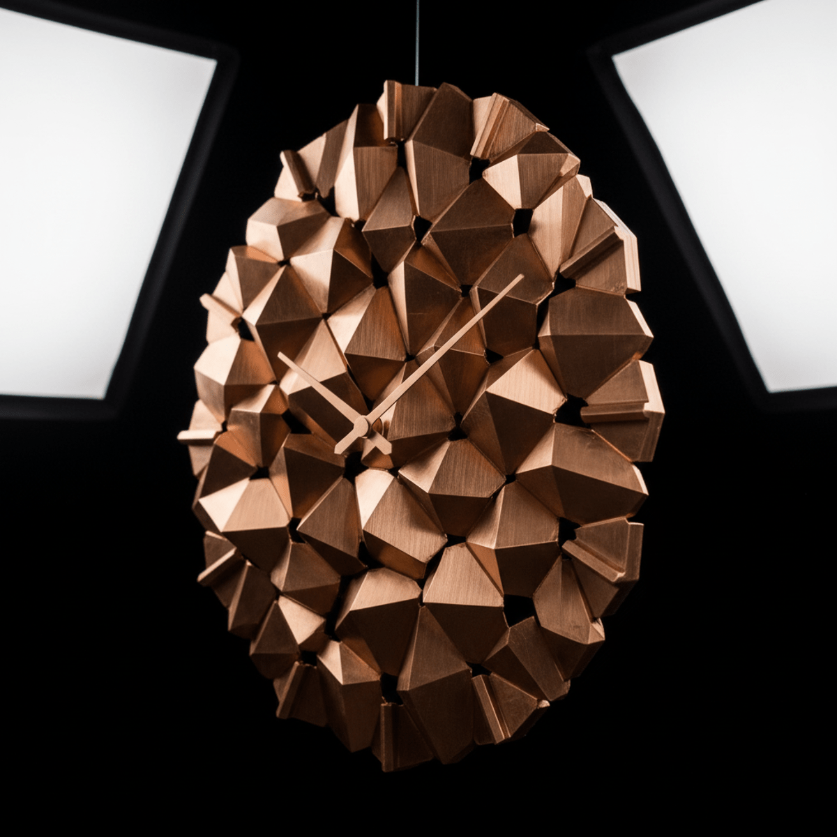 Close-up of a 3D-printed copper clock with dynamic tessellated patterns.