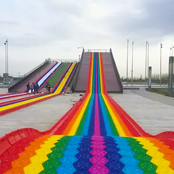 Fun outdoor playground entertainment games children's grass sliding way rainbow dry snow slide