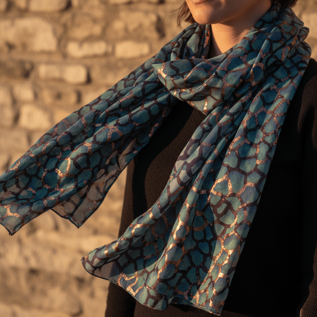 Bohemian abstract snakeskin mosaic scarf in teal, violet, and copper tones.