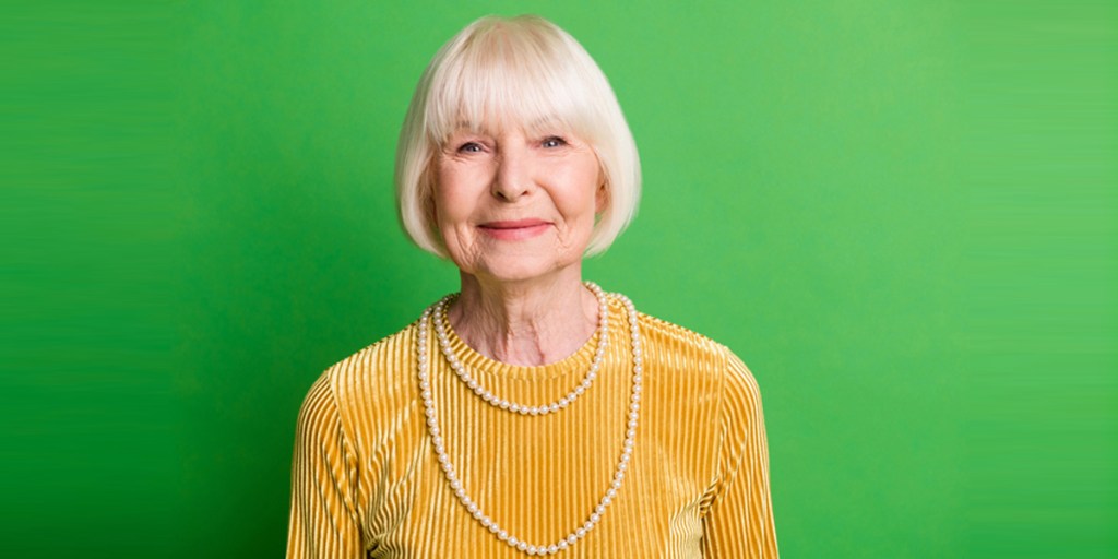 An elderly woman with a short bob cut