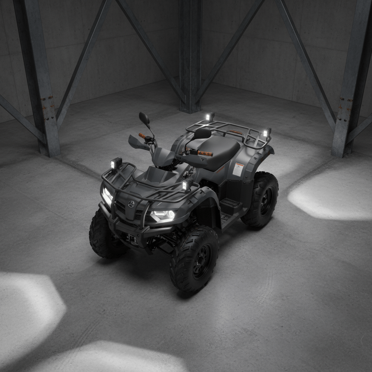 Overhead shot of a stealth gray ATV in a modern industrial garage, with LED lights on.