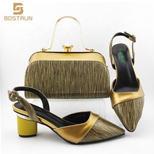 gold sandals and matching bag