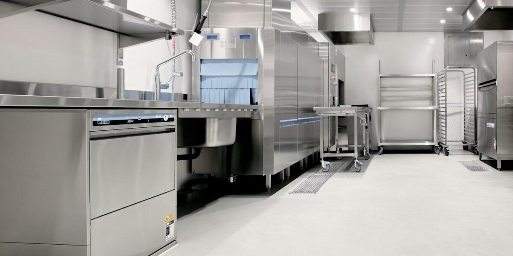 Stainless steel commercial kitchen with industrial appliances