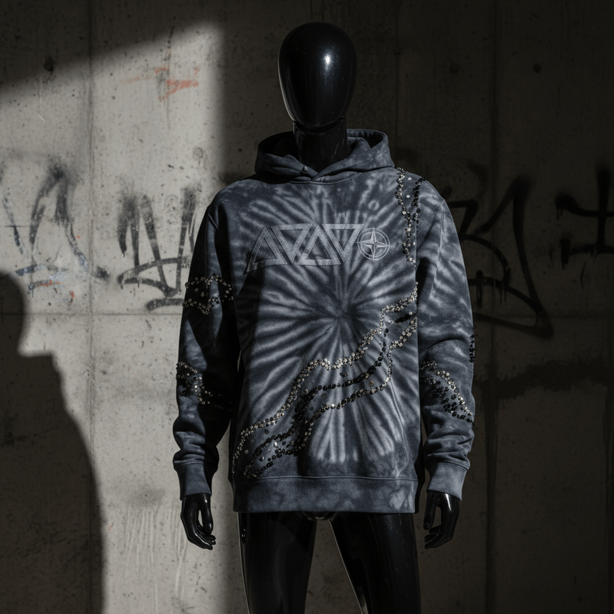 Bold tie-dye sweatshirt with puff-print logos and rhinestone geode patterns.