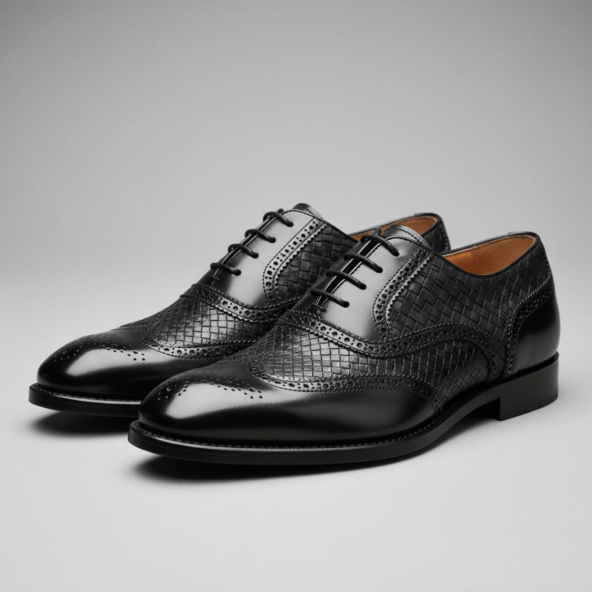Elegant black men's Derby shoes showcasing textured panels and artisanal stitching.