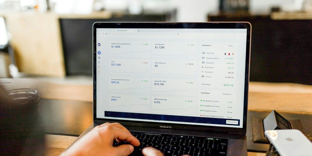 A laptop screen showing numbers and statistics