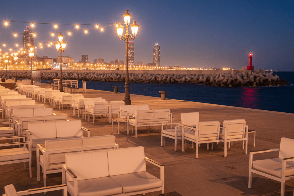 Wide-angle view of Barcelona's Port Olímpic nightlife area under ambient light, highlighting potential hazards like nearby breakwaters
