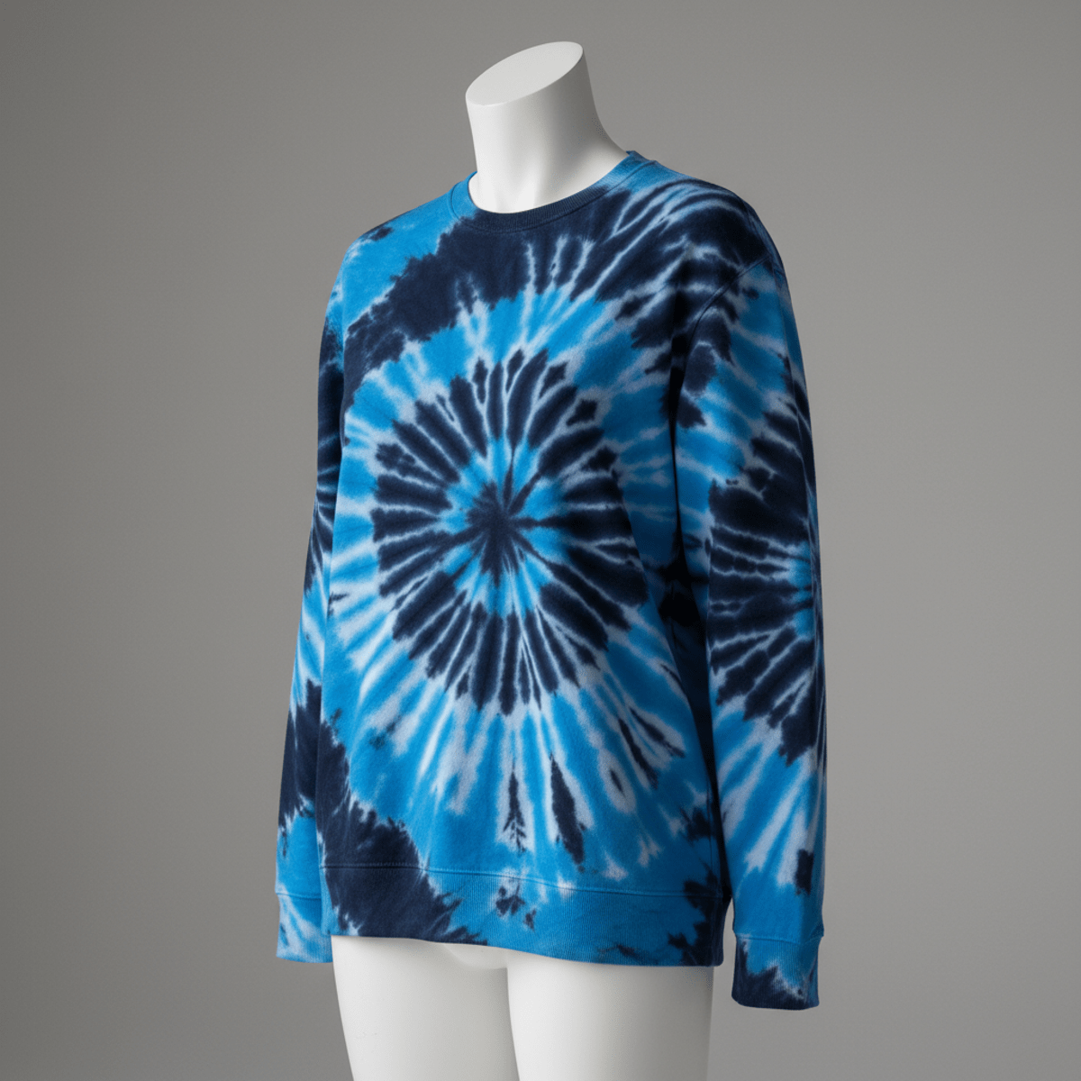 Modern tie-dye sweatshirt with blue swirls and fine knit cotton texture.