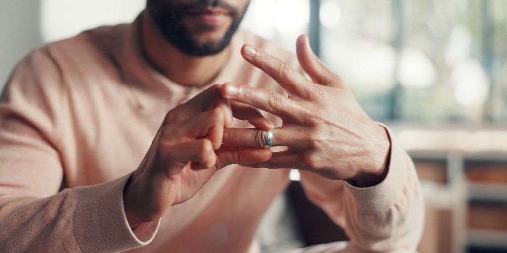 Man taking off wedding ring