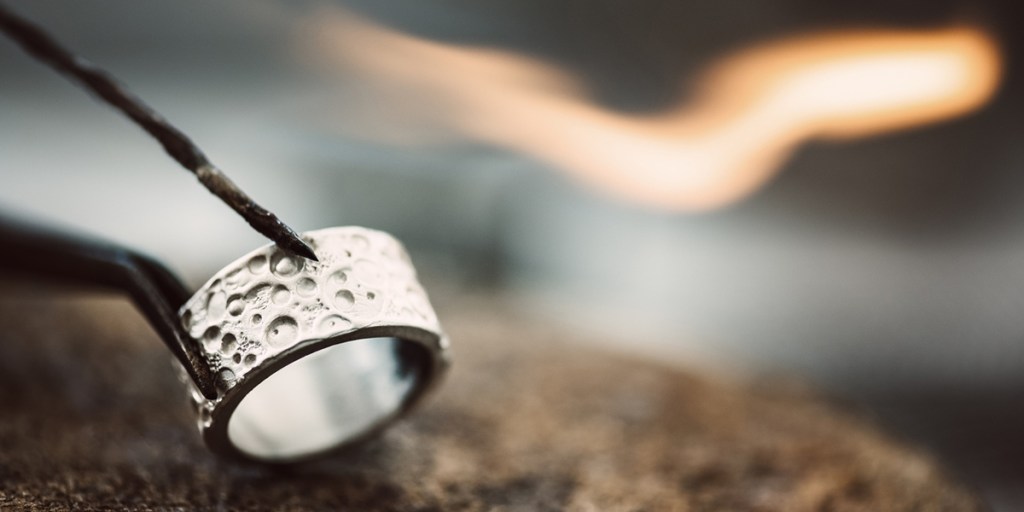 Tongs holding a ring