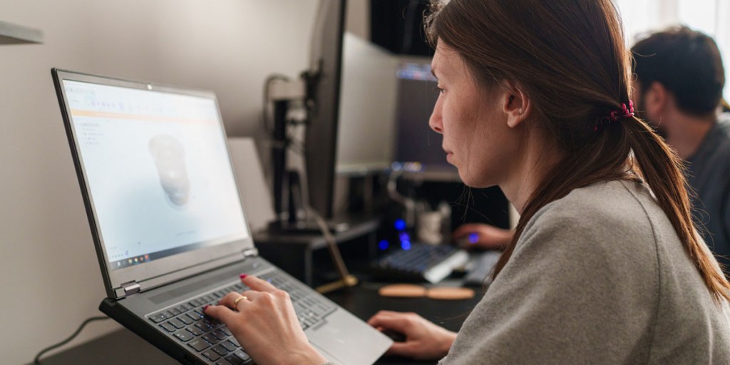 Woman creating a 3D model on a computer