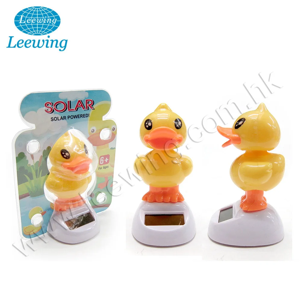 Забавная пластиковая желтая утка на солнечной энергии