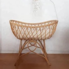 antique wicker baby bassinet on wheels