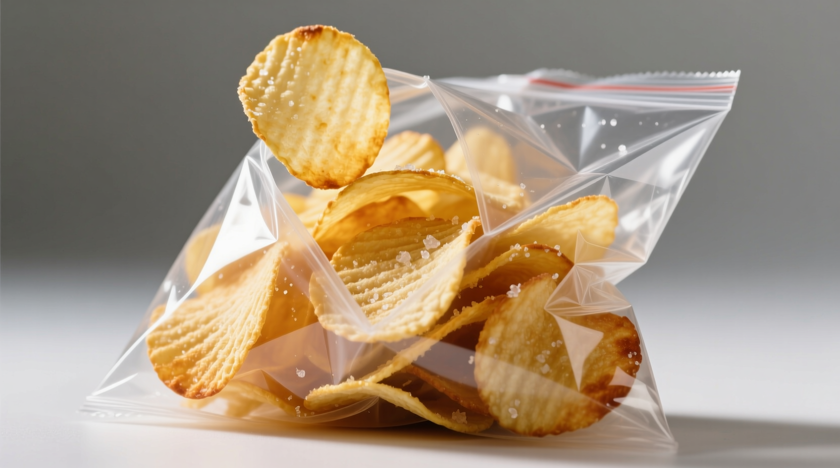 Fresh potato chips in a clear bag with visible texture